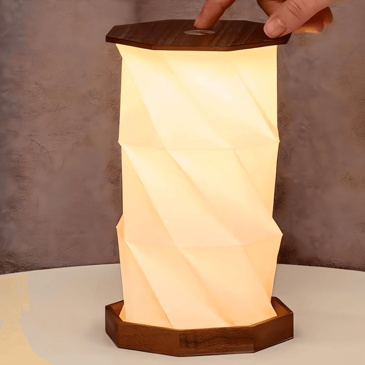 Twist Hexagon Lamp in Walnut, featuring a modern design with elegant folds and warm light for stylish decor.