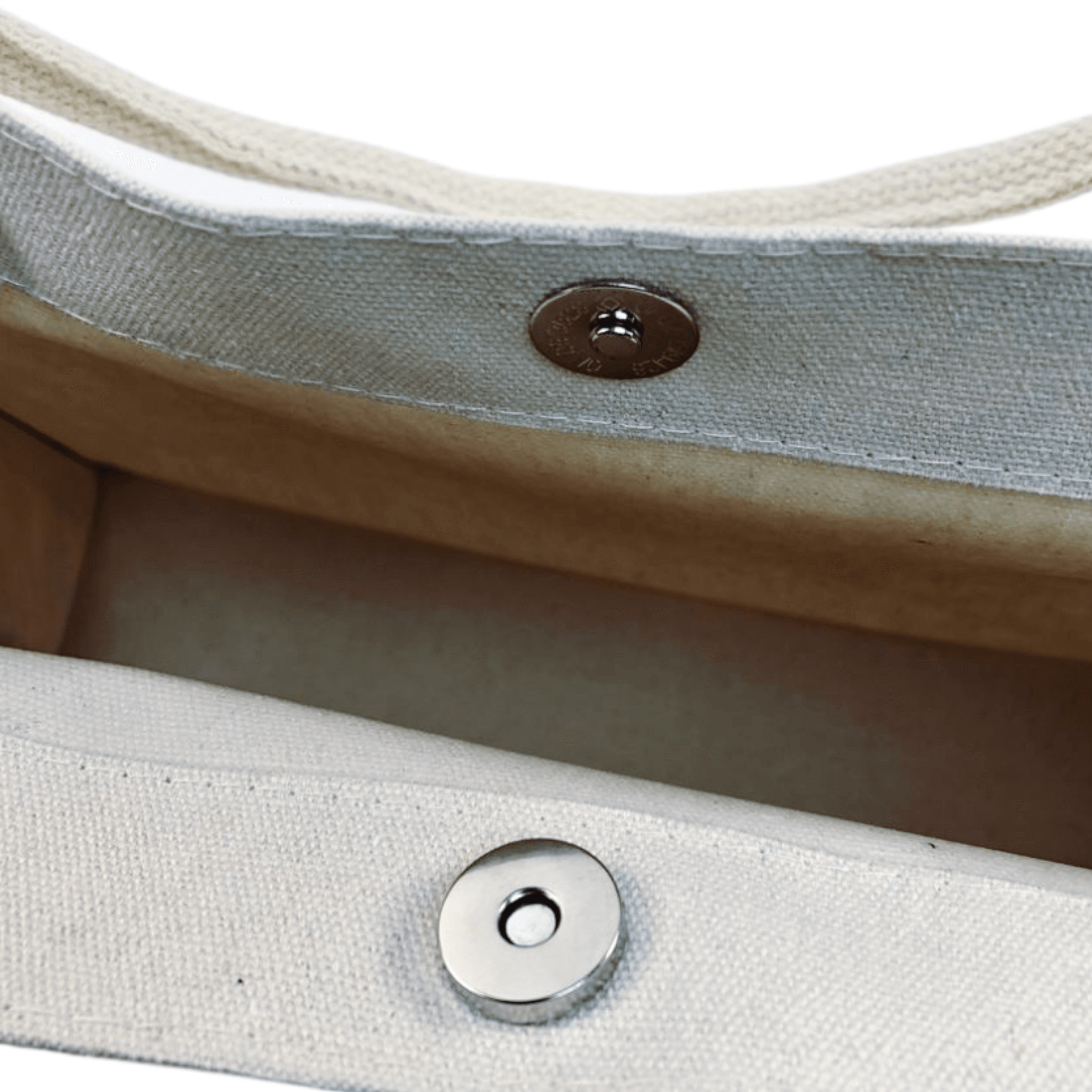 Inside view of a cozy oil painting canvas tote bag featuring button closure and sturdy stitching.