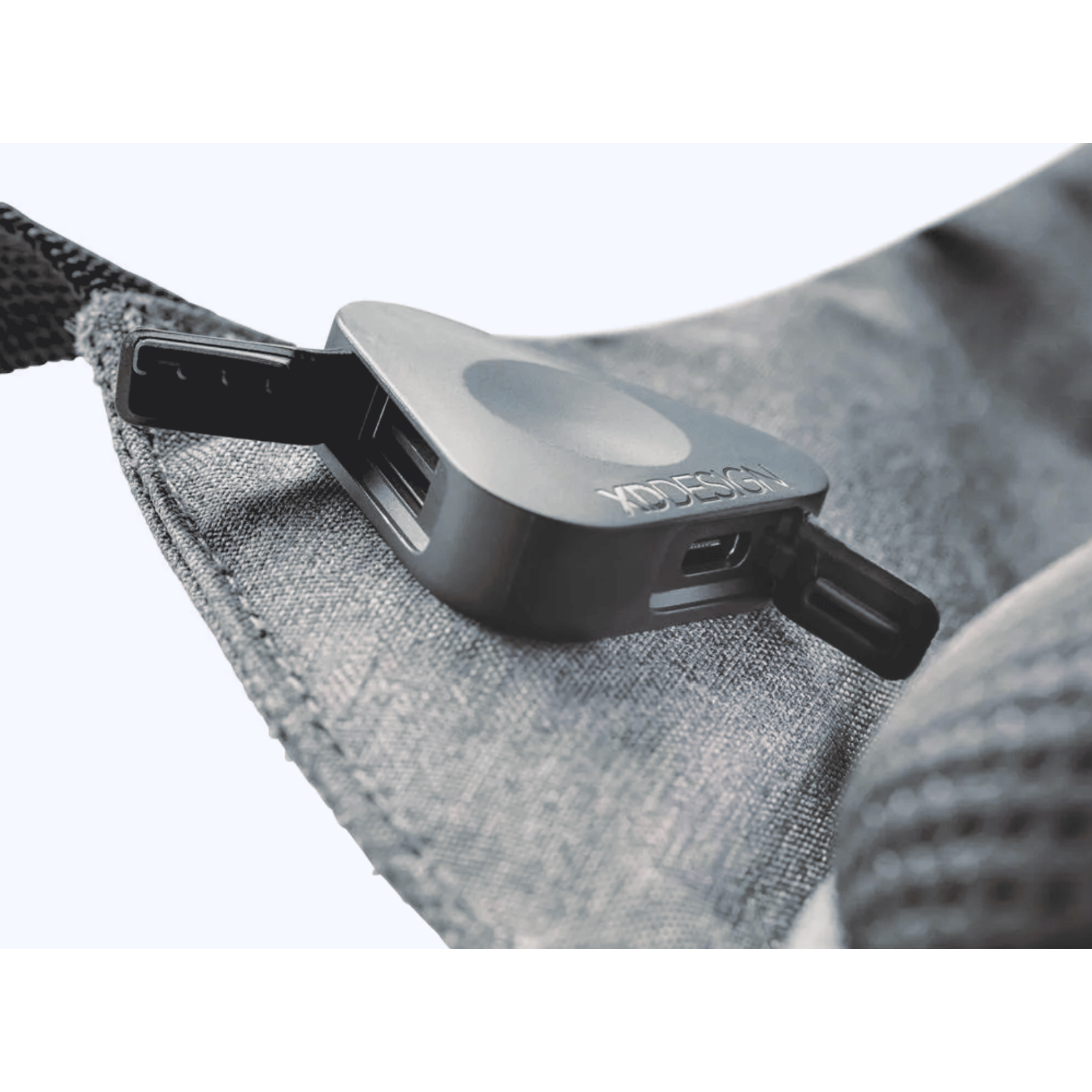 Close-up of XD Design Bobby Pro Anti-Theft Backpack charging port detail, showcasing sleek design and functionality.