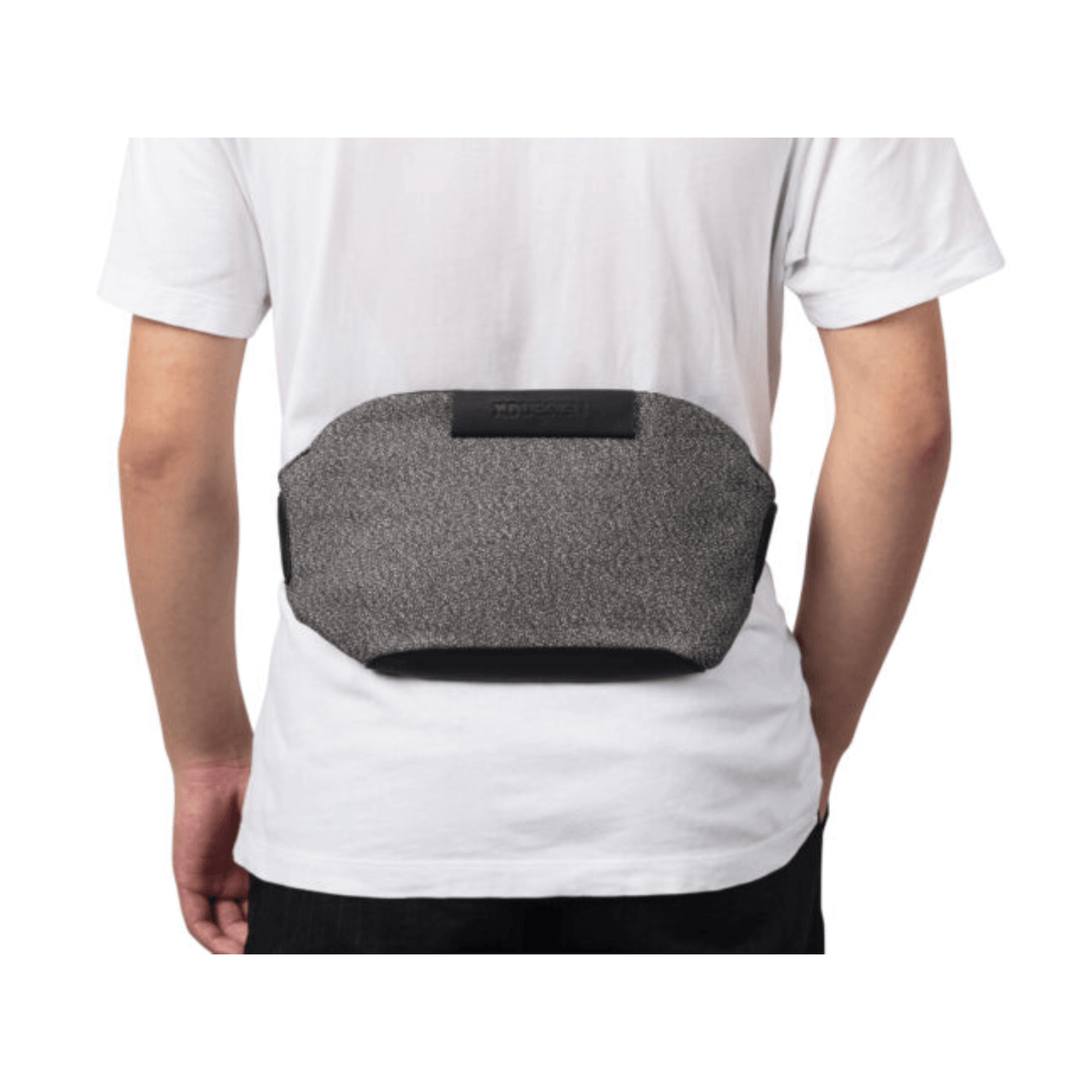 Urban Anti-Theft Bumbag in grey worn on the back of a person, showcasing its sleek, secure design.