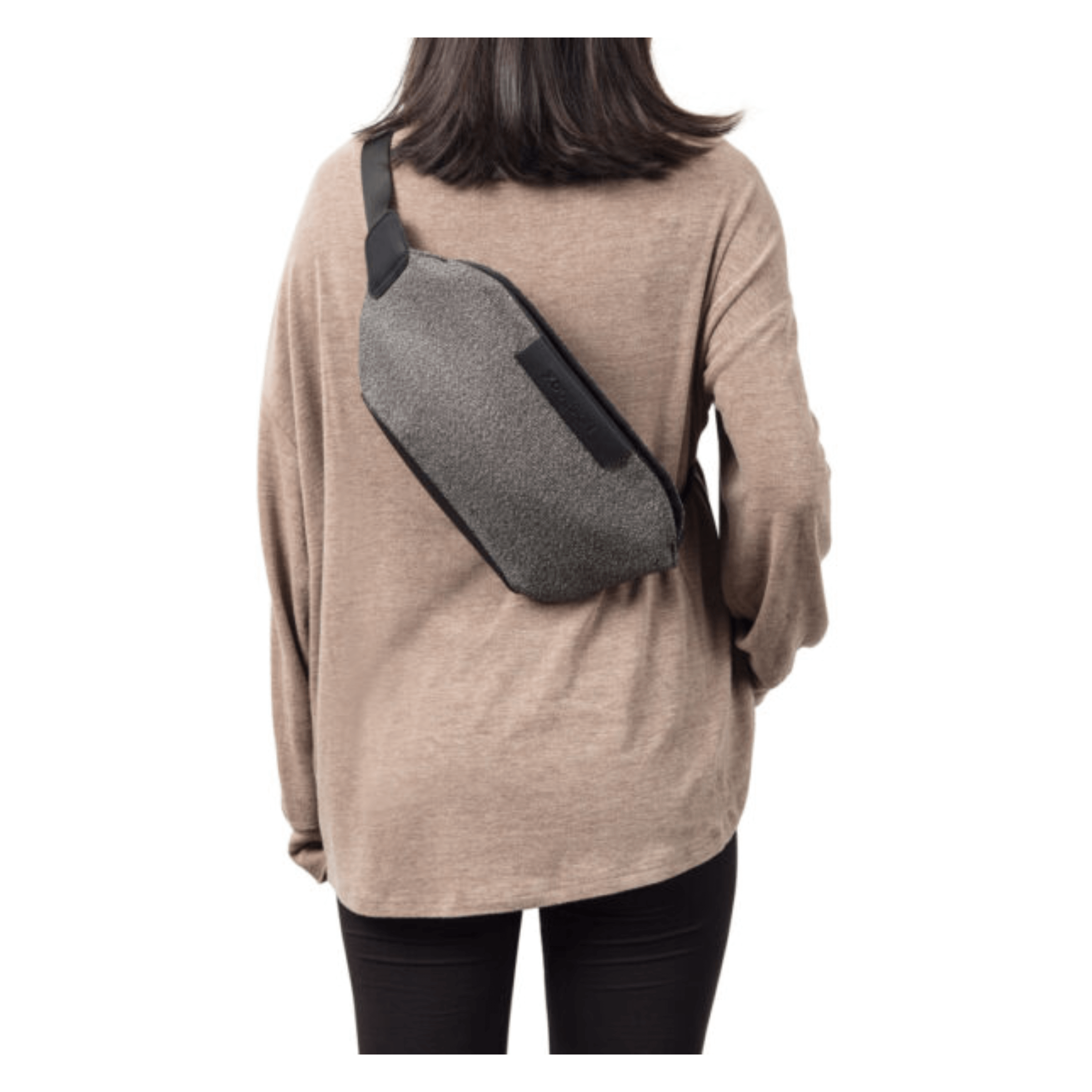 Woman wearing a grey Urban Anti-Theft Bumbag as a stylish crossbody bag.