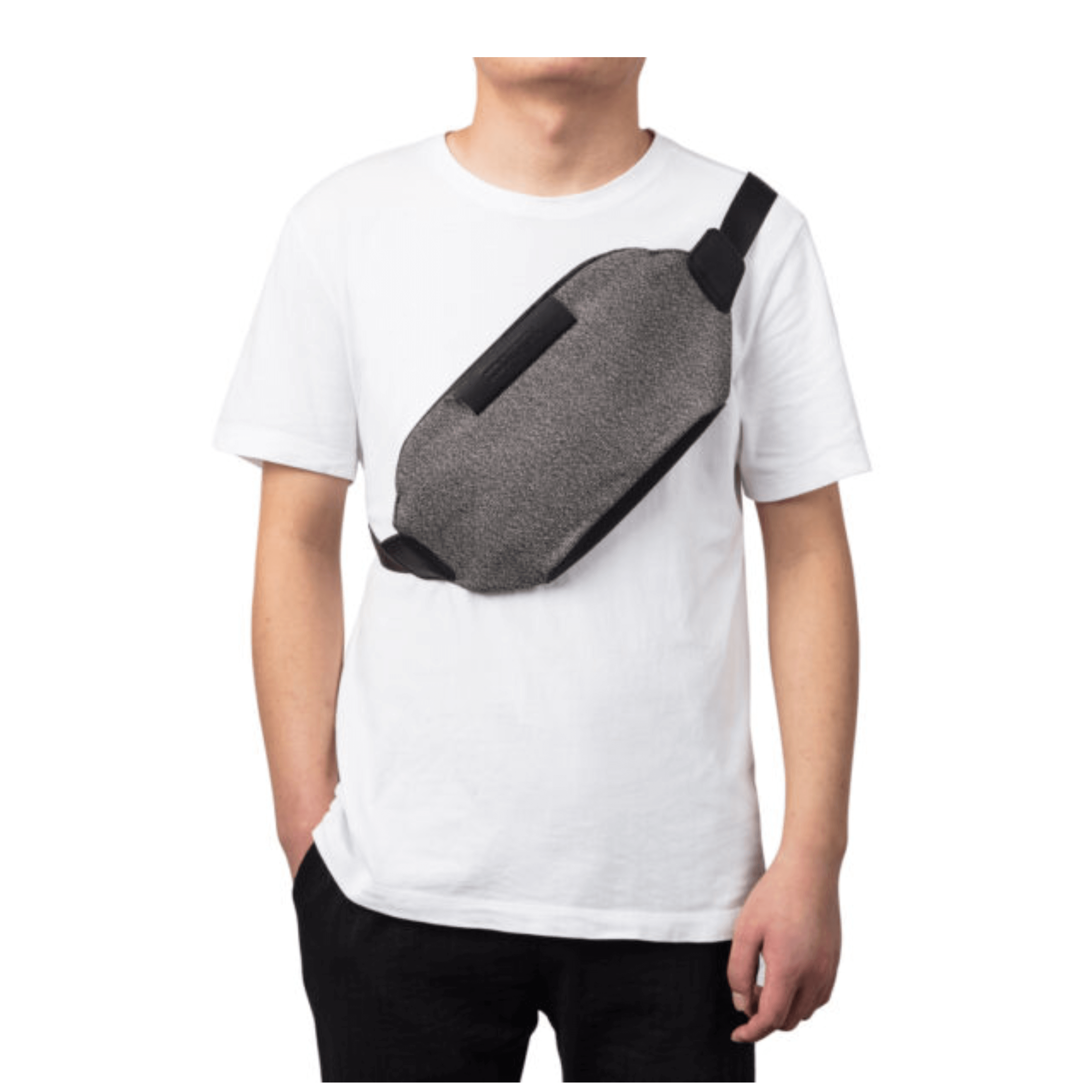 Man wearing a grey anti-theft bumbag over a white shirt, showcasing stylish and secure design.